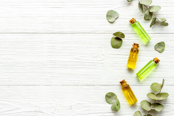 Essential eucalyptus oil in glass bottle. Herbs cosmetic and skincare product concept