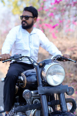 Naklejka premium man on a motorbike on the road riding. having fun driving the empty road on a motorcycle tour journey. copy space for your individual text 