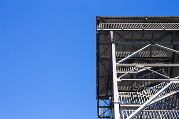 A view of the top of the steel observation tower. The object against the blue sky