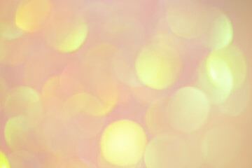 Golden bokeh on pink background. Blurred background.