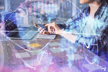 Multi exposure of woman hands typing on computer and business theme hologram drawing. Success...