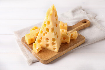 Tasty fresh cheese on white wooden table
