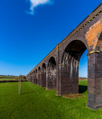 Fototapeta na wymiar A view of the west section of the largest brick viaduct in the UK, the Welland Valley viaduct on a bright sunny spring day 