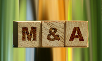 Wooden cubes with the abbreviation M and A on them. Business concept