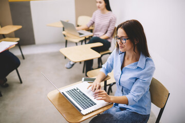 Young manager working on laptop in meeting room