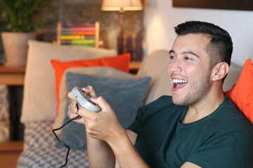 Ecstatic boy playing video games © ajr_images