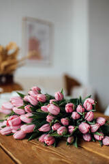 bouquet of tulips on wood table. Border design