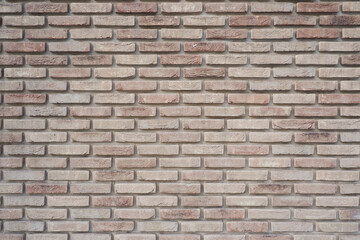 The wall is made of ceramic clinker bricks. Natural urban background. Space for creativity and text. Seamless background- abstract nature pattern.