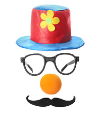 Funny clown's face made of hat, eyeglasses, foam nose and mustache on white background
