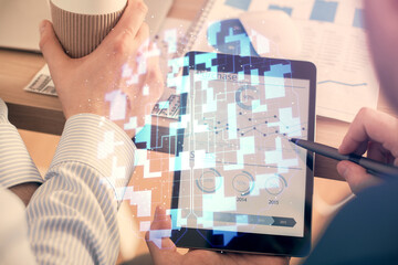 Multi exposure of man's hands holding and using a digital device and data theme drawing. Innovation...