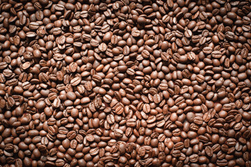 Popular natural food products,freshly roasted Arabica coffee beans background.