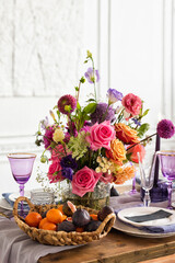 Beautiful flower composition on the wooden table