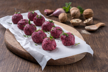Georgian beetroot phali or pkhali with walnuts, garlic and spices on black plate