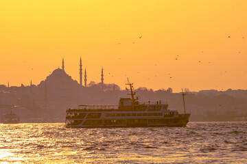 Ferry and cityscape of Istanbul at sunset