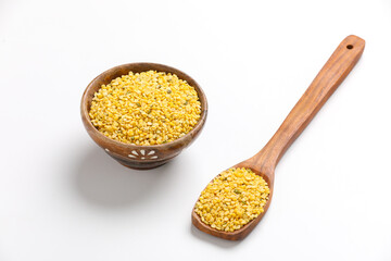 yellow moong mung dal lentil pulse bean on white background.