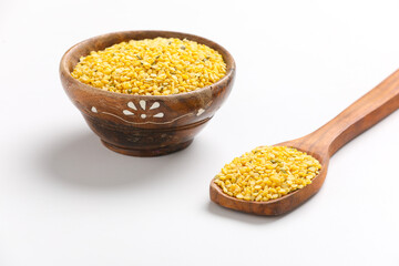 yellow moong mung dal lentil pulse bean on white background.