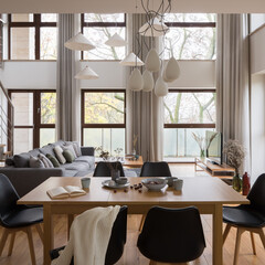 Wooden dining table in spacious living room