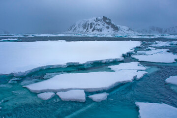 Drift floating Ice and Snowcapped Mountains, Albert I Land, Arctic, Spitsbergen, Svalbard, Norway, Europe