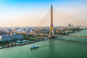 Bangkok Transportation at Dusk with the bridge across the river (Thailand)