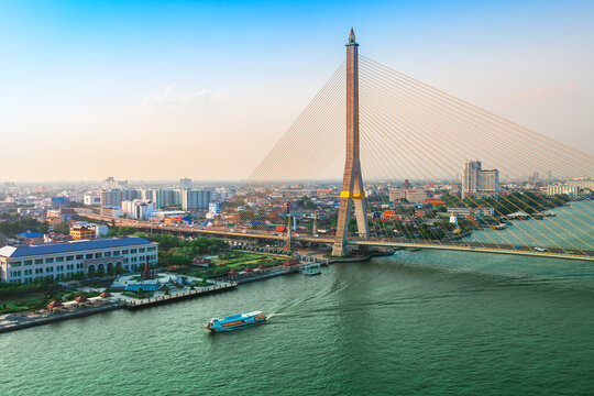 Bangkok Transportation at Dusk with the bridge across the river (Thailand)