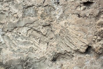 concrete wall with rough smears of cement gray background.