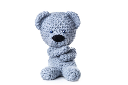 Bear handmade toy isolated on white background. Crochet blue bear