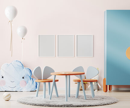 Poster frame mock up in interior of children room with pink wall, colorful kids table and toys, kids playroom interior, 3d rendering