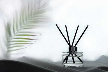 luxury aroma scent reed diffuser glass bottles are on the table with table runner to creat romantic and relax ambient in the bedroom with white wall background in the morning for happy valentine day