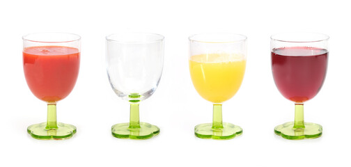 Natural fruit, berry and vegetable juices in a glass isolated on a white background