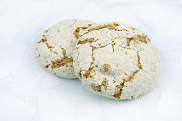 Italian biscuits on merengue on a white background. Crispy biscuits with nuts.