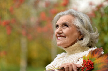 happy  senior beautiful woman with berries