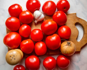 Ripe red tomatoes, onions and garlic.