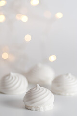 White meringue background with backlights. Front view. Macro photography