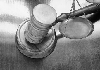 Wooden gavel and balance scale, court and law concept