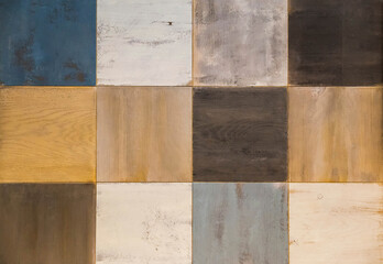 Wooden wall painted in different colors. Interior element