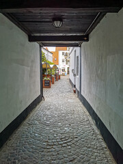 tunnel into public patio of flensburg, old town, germany