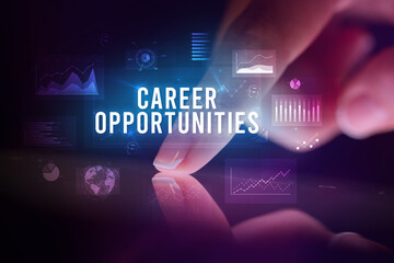 Finger touching tablet with business graphs and icons concept