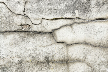Obraz na płótnie Canvas Gray cement black cracks background. Scratched lines texture. White and black distressed grunge concrete wall pattern for graphic design. Peel paint crack. Weathered rustic surface.