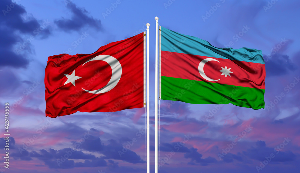 Wall mural Azerbaijan and Turkey two flags on flagpoles and blue sky