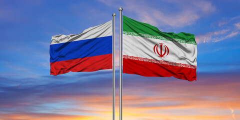 Iran Russia national flag cloth fabric waving on the sky with beautiful sun light
