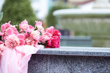 Peonies bouquet background. Spring, summer bright concept. Fresh green background