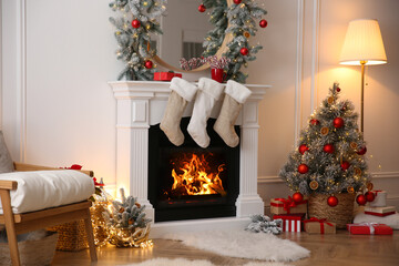 Fireplace with Christmas stockings in beautifully decorated living room
