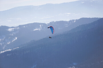 paraglide with a mountain background