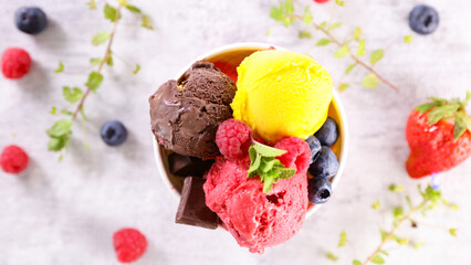 scoop of chocolate,  strawberry and mango ice cream