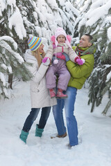 Fototapeta na wymiar happy family at beautiful sunny winter day outdoor in nature