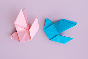 Origami birds blue and pink symbolizing love and romance