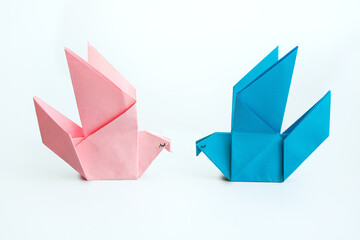 Origami birds blue and pink symbolizing love and romance