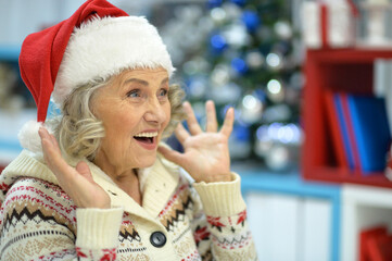 Senior woman in Santa hat