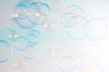 Beautiful blur transparent blue soap bubbles floating in the air.