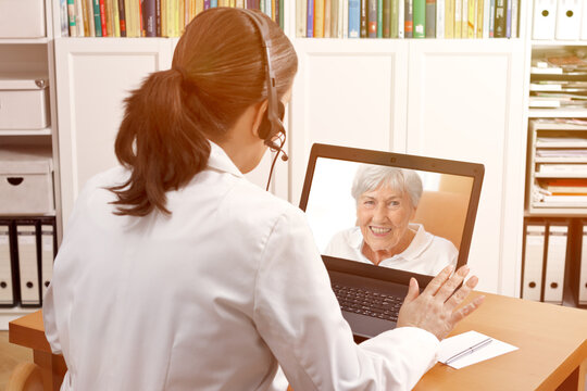 Telehealth or telemedicine concept: doctor of geriatrics during an online consultation with her senior patient.